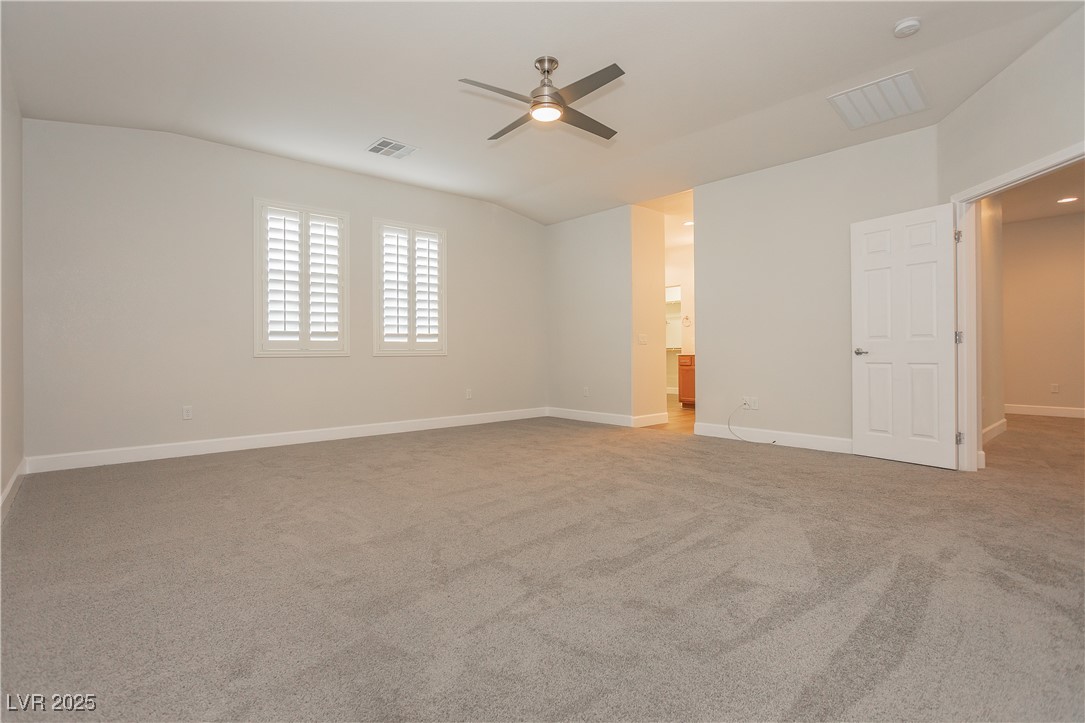971 Huntington Cove Parkway Las Vegas, NV 89178 - Photo 40 of 55 Carpeted spare room featuring a ceiling fan and baseboards