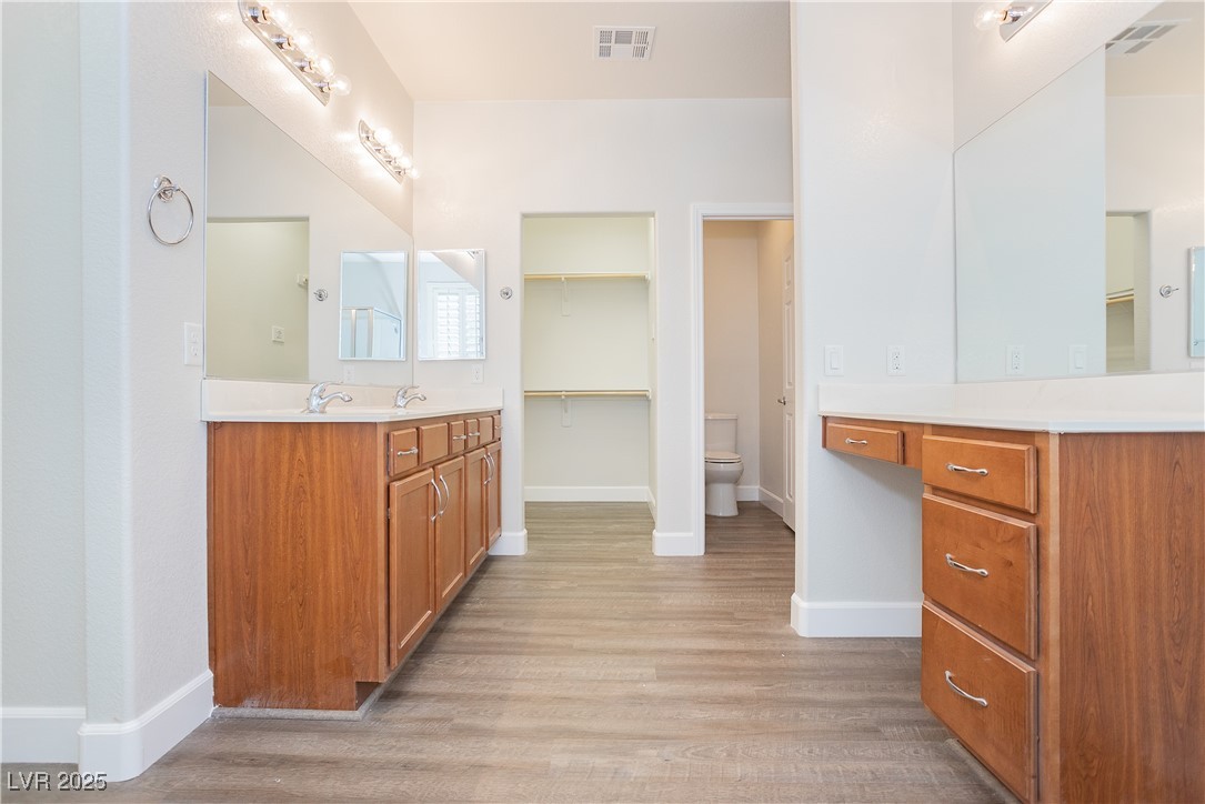 971 Huntington Cove Parkway Las Vegas, NV 89178 - Photo 46 of 55 Bathroom featuring wood finished floors and vanity
