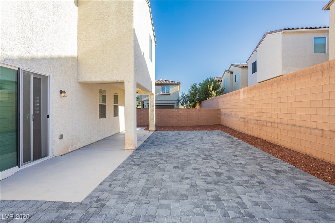 971 Huntington Cove Parkway Las Vegas, NV 89178 - Photo 49 of 55 Fenced backyard with a patio