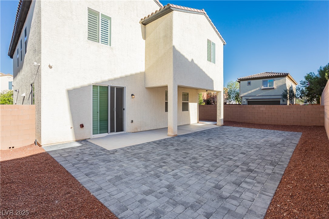 971 Huntington Cove Parkway Las Vegas, NV 89178 - Photo 50 of 55 Rear view of property with a patio area, a fenced backyard, stucco siding, and a tiled roof