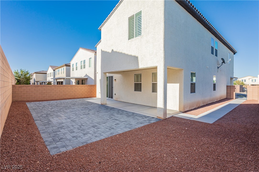 971 Huntington Cove Parkway Las Vegas, NV 89178 - Photo 51 of 55 Rear view of property with a fenced backyard, a patio, stucco siding, and a residential view