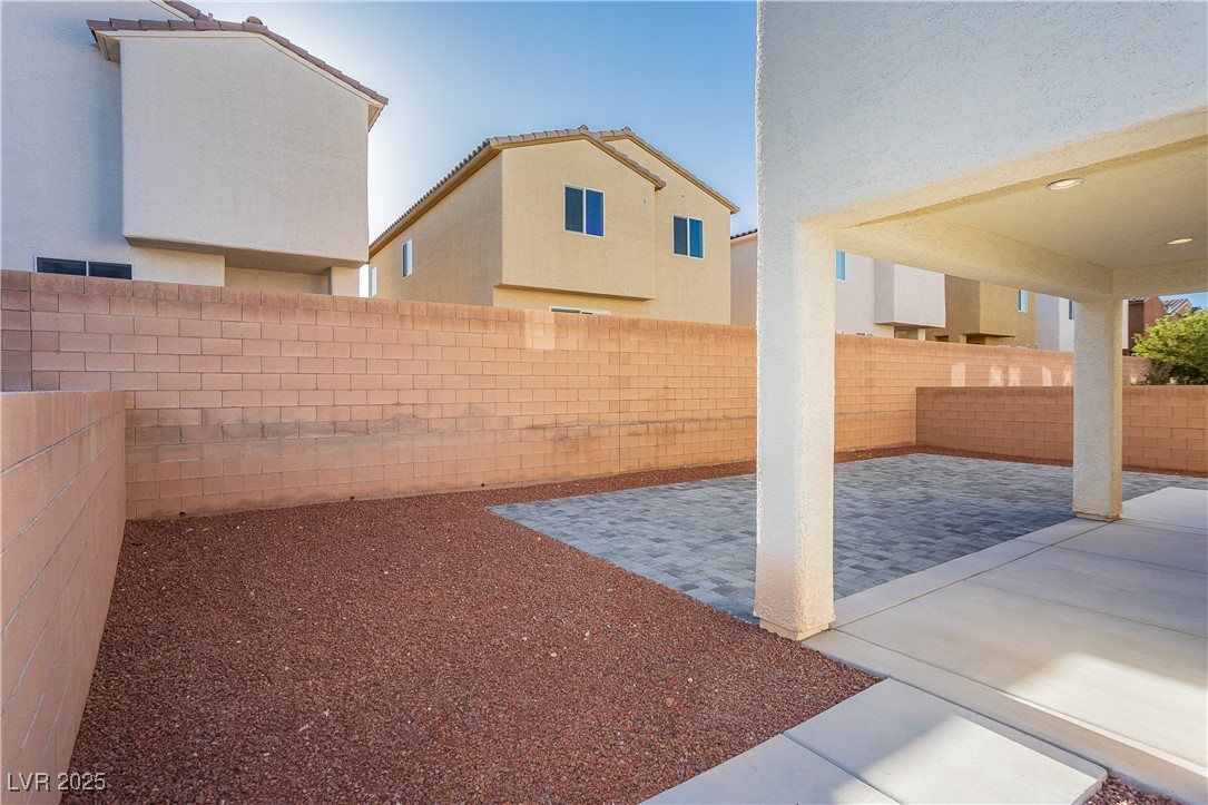 971 Huntington Cove Parkway Las Vegas, NV 89178 - Photo 53 of 55 Fenced backyard featuring a patio area