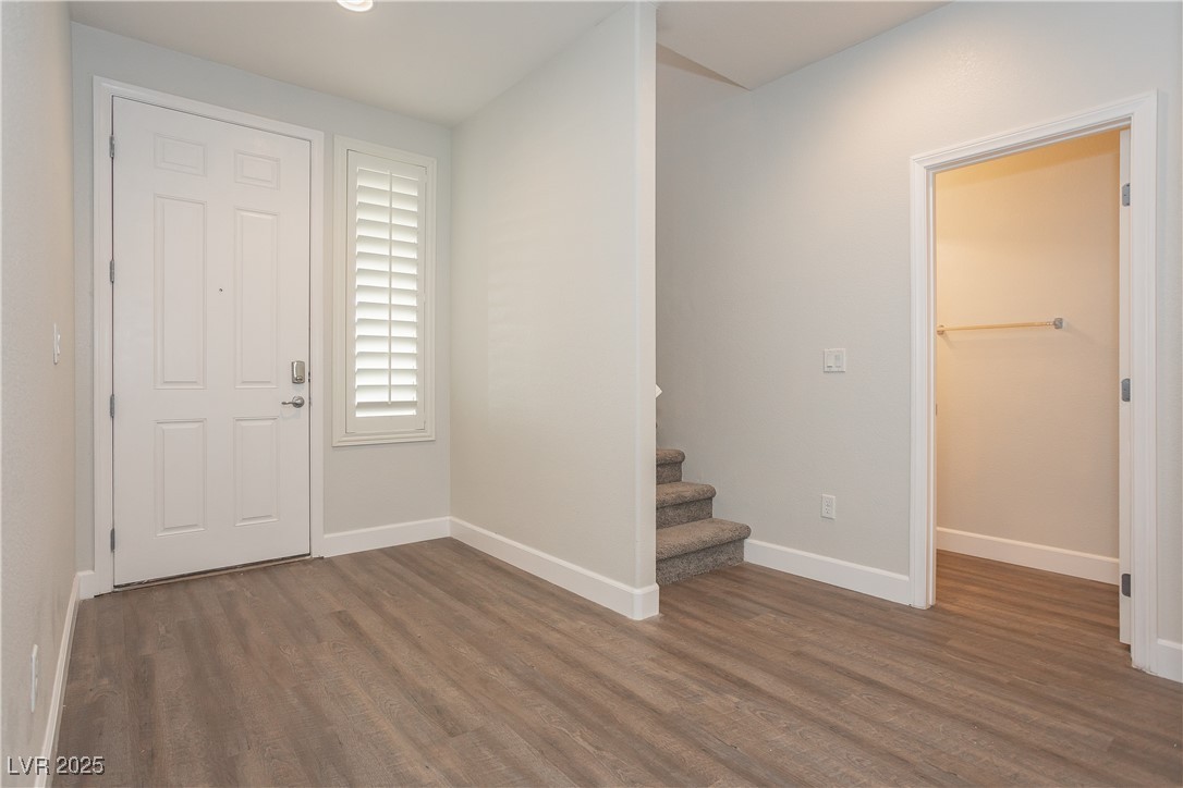 971 Huntington Cove Parkway Las Vegas, NV 89178 - Photo 8 of 55 Entryway with wood finished floors and stairs