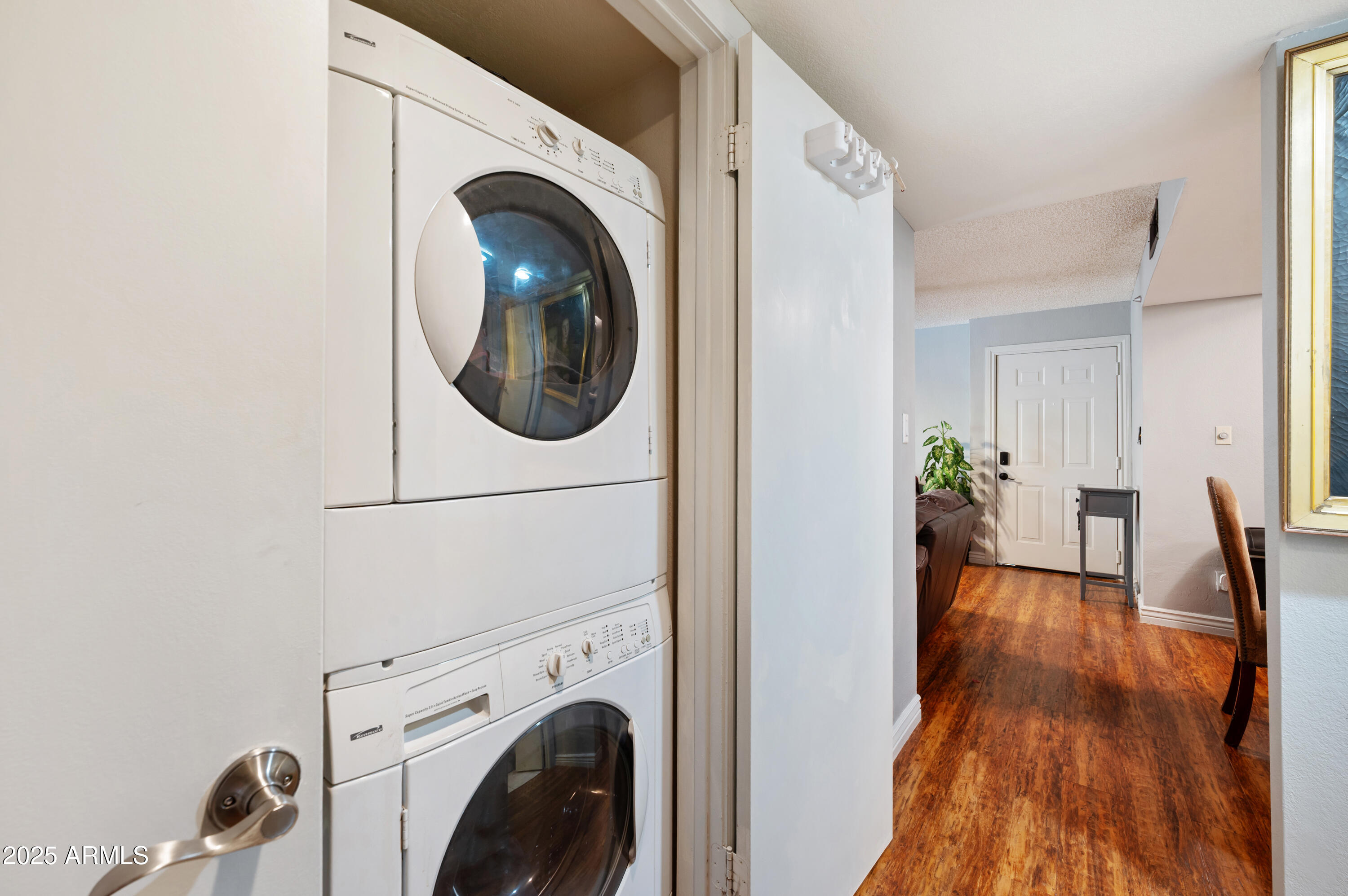 5518 East Lindstrom Lane, Unit 1011 Mesa, AZ 85215 - Photo 14 of 32 a view of a hallway with washer and dryer