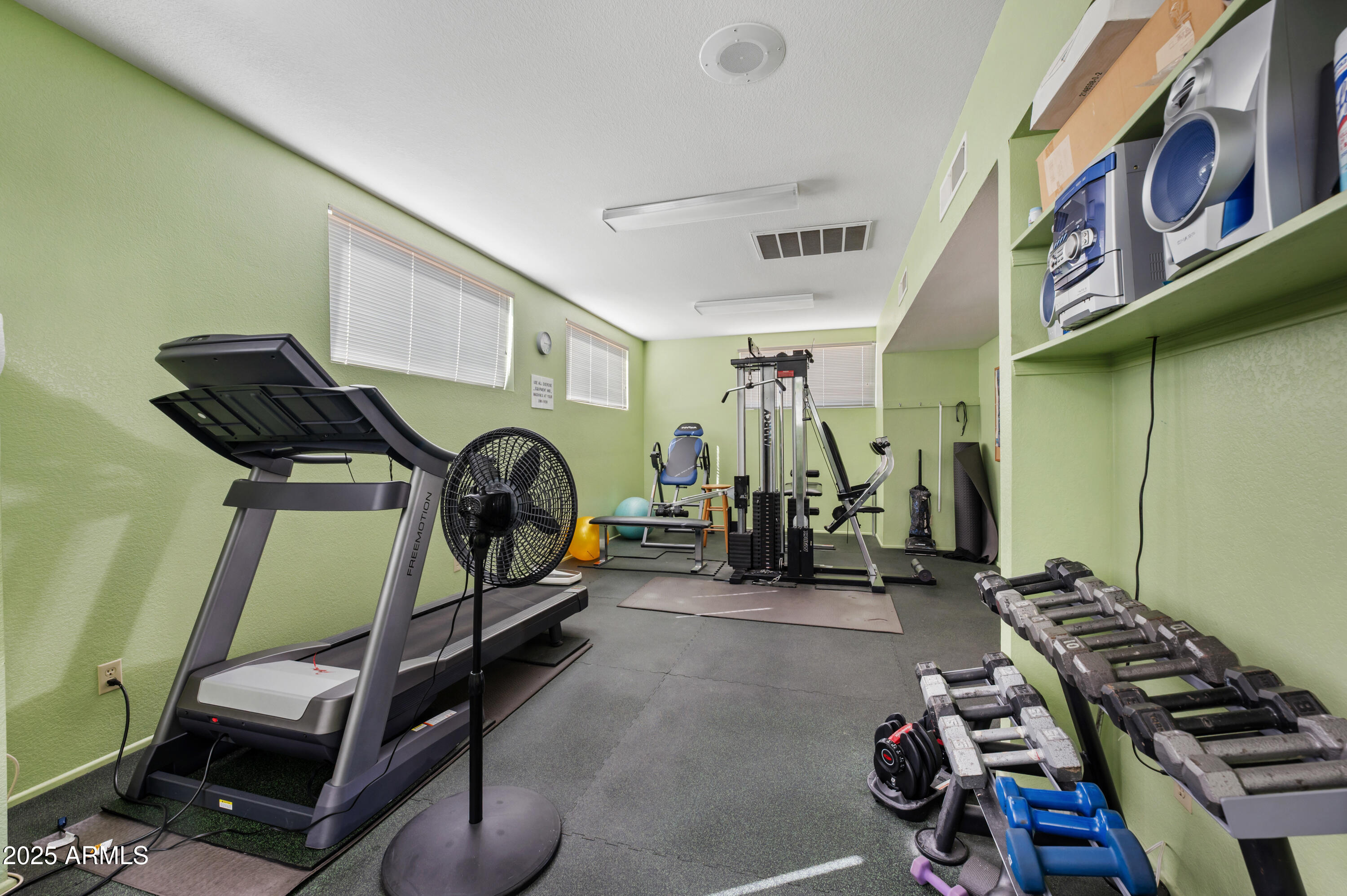 5518 East Lindstrom Lane, Unit 1011 Mesa, AZ 85215 - Photo 23 of 32 a room with gym equipment