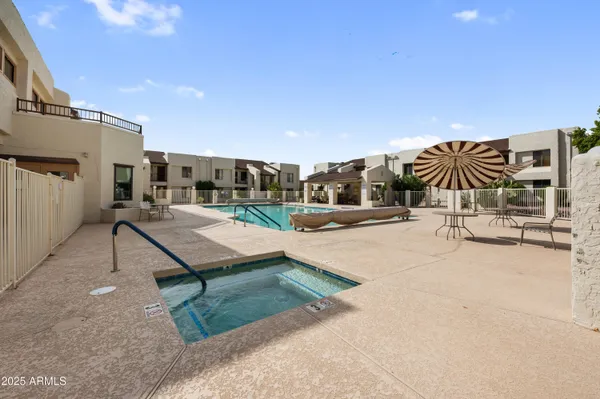 a swimming pool with yard and outdoor seating