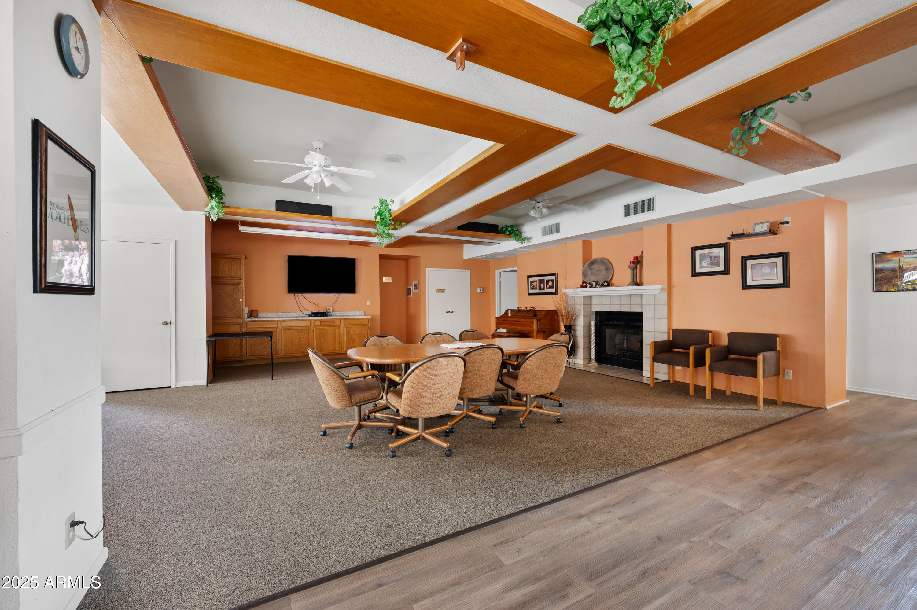 5518 East Lindstrom Lane, Unit 1011 Mesa, AZ 85215 - Photo 28 of 32 a living room with furniture a table and chairs