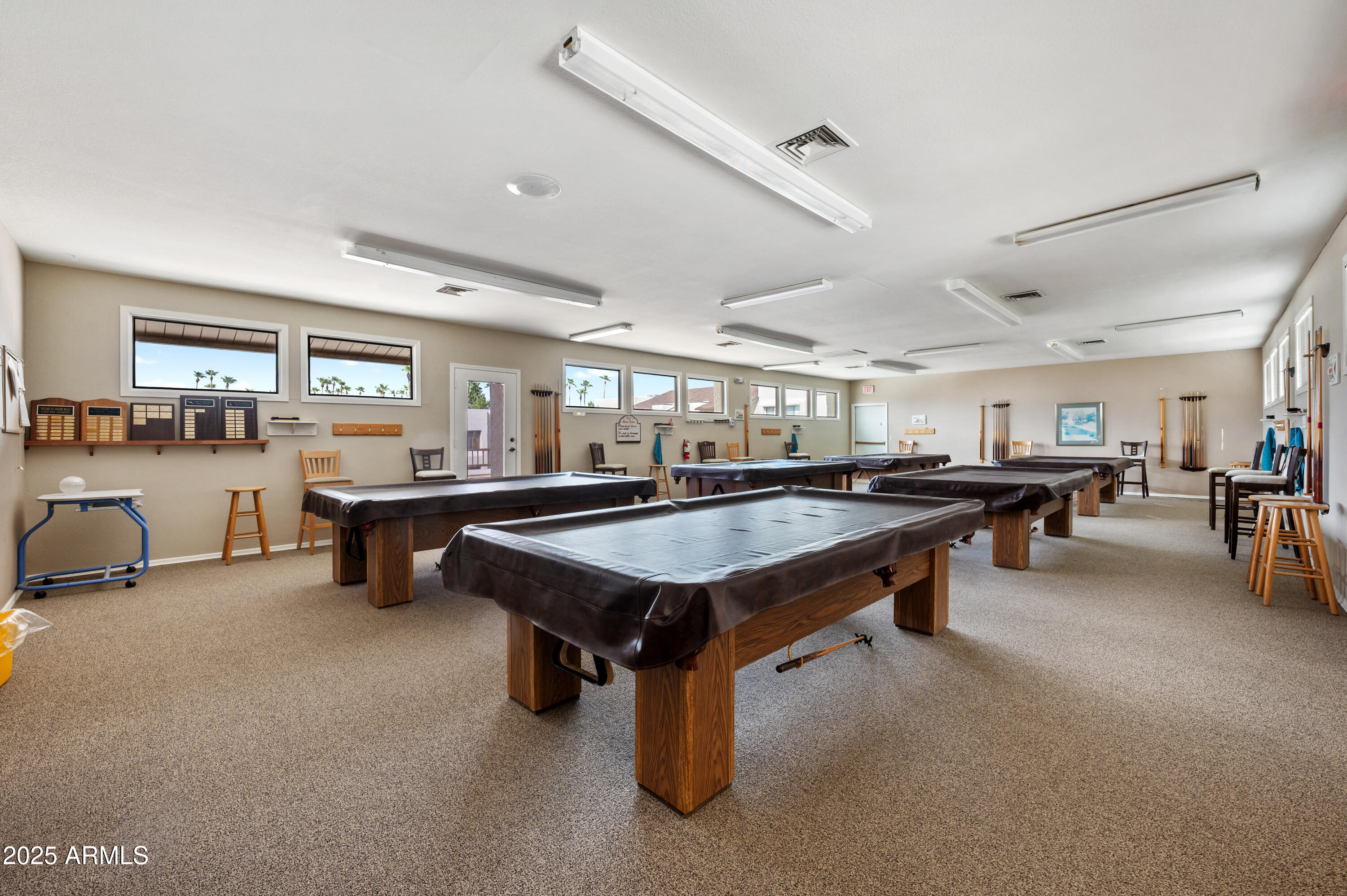 5518 East Lindstrom Lane, Unit 1011 Mesa, AZ 85215 - Photo 30 of 32 a room with lots of furniture and a faucet