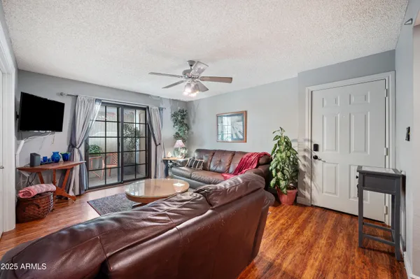 a living room with furniture and a large window