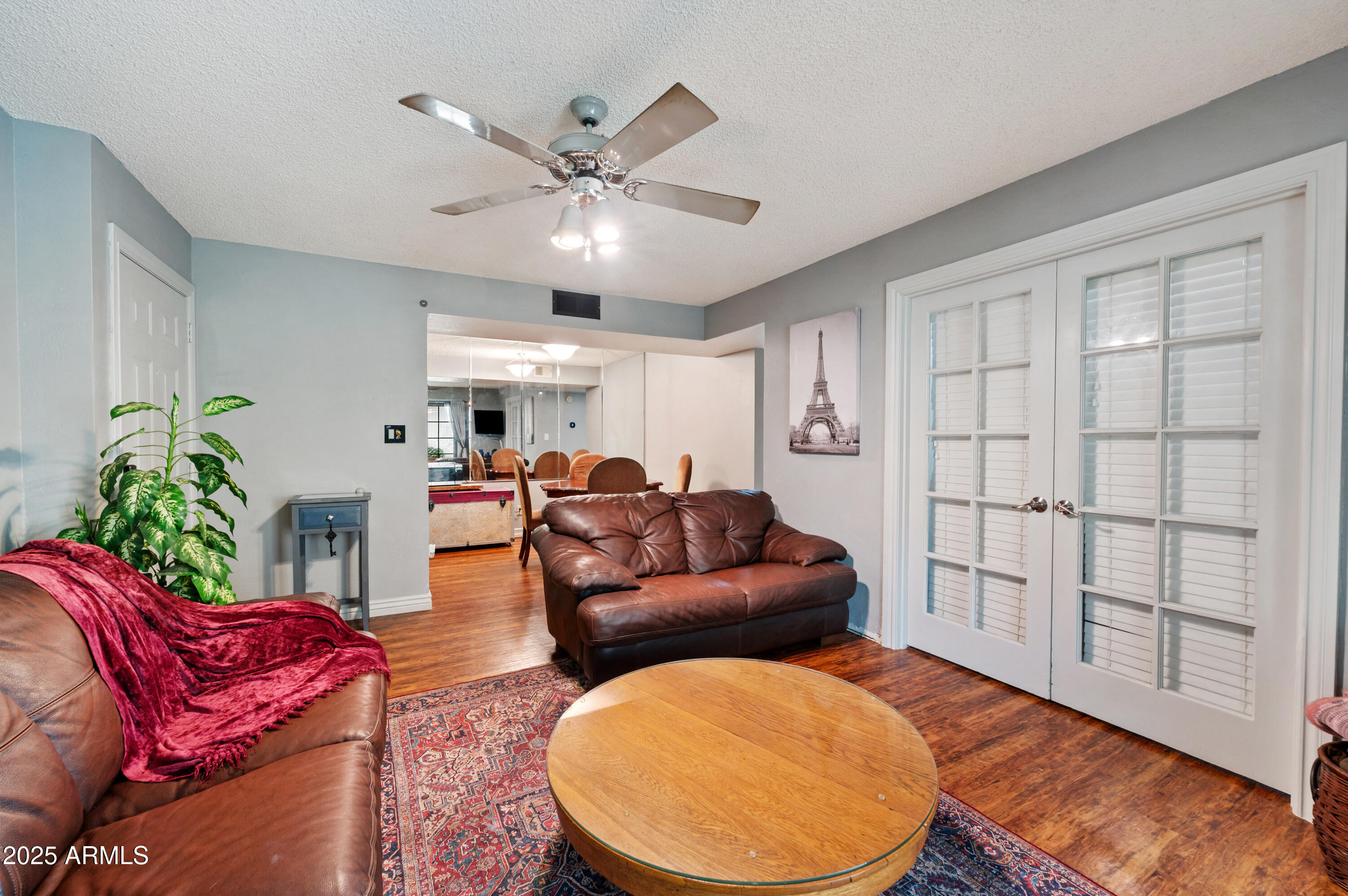 5518 East Lindstrom Lane, Unit 1011 Mesa, AZ 85215 - Photo 6 of 32 a living room with furniture and a large window