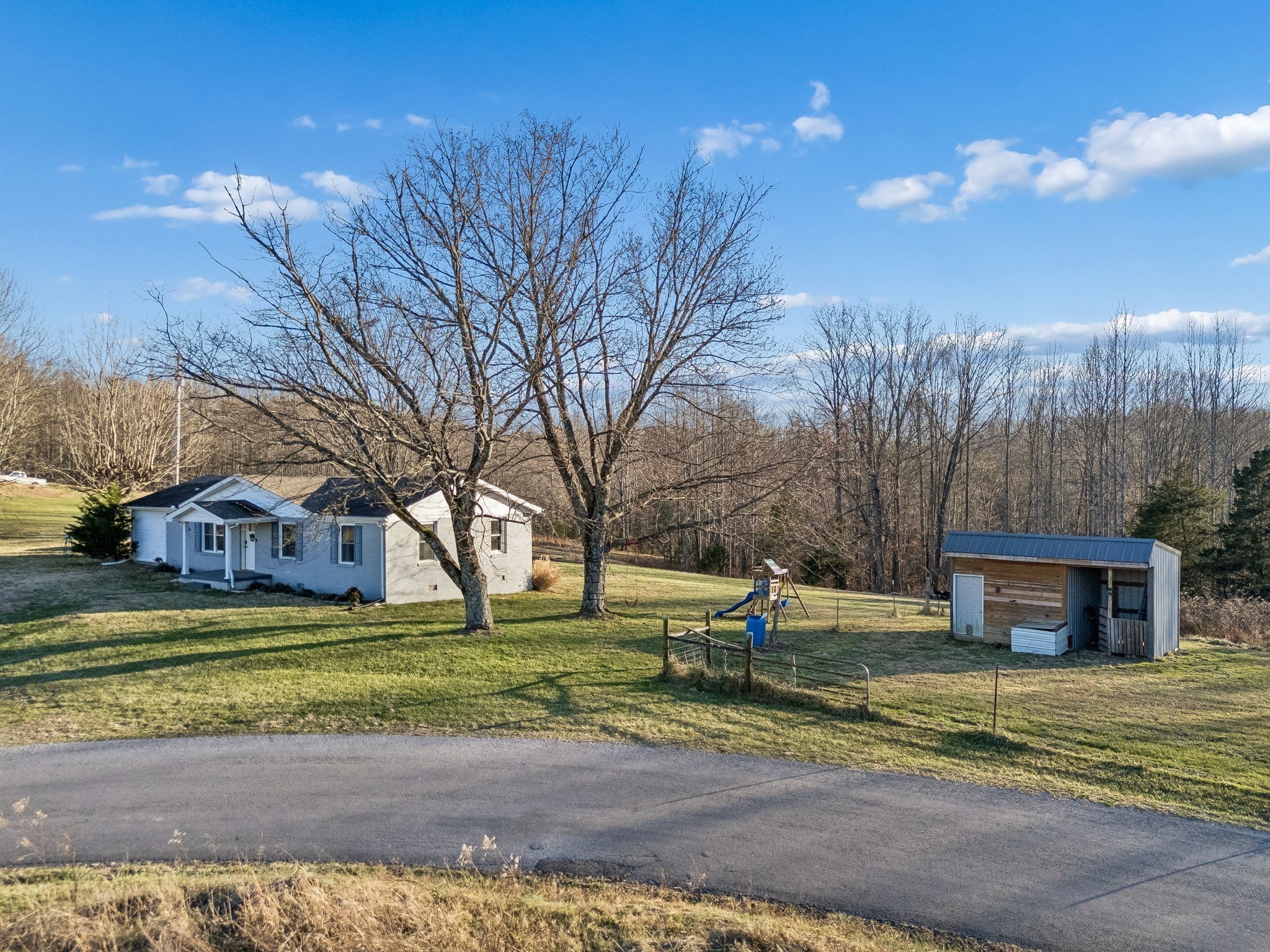 411 Purtle Road Lafayette, TN 37083 - Photo 37 of 40 a view of a house with a yard