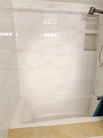 a view of balcony with furniture