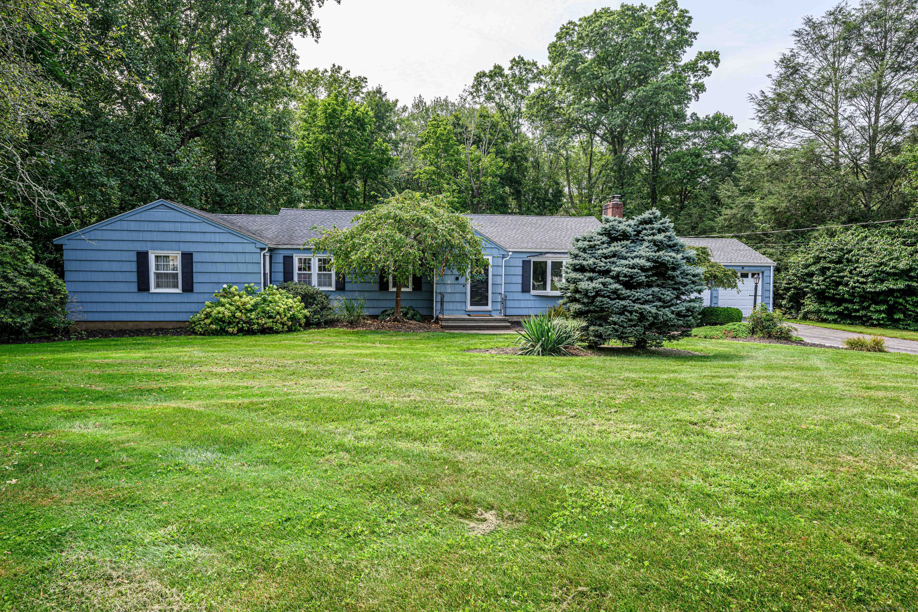 328 Fairlea Road Orange, CT 06477 - Photo 1 of 1 a front view of a house with garden