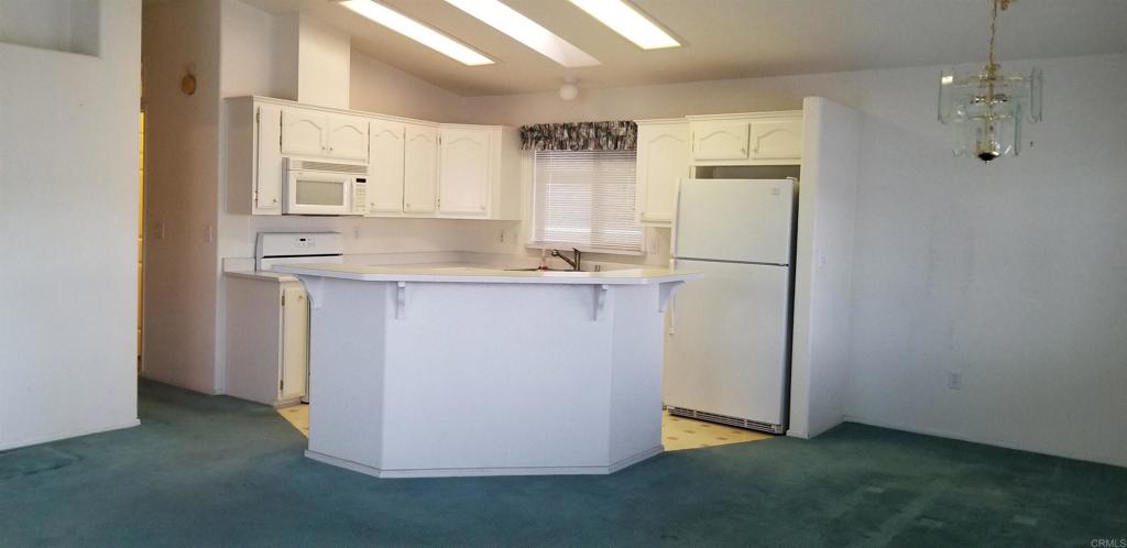 165 Roadrunner Lane Oceanside, CA 92057 - Photo 4 of 20 a utility room with cabinets washer and dryer