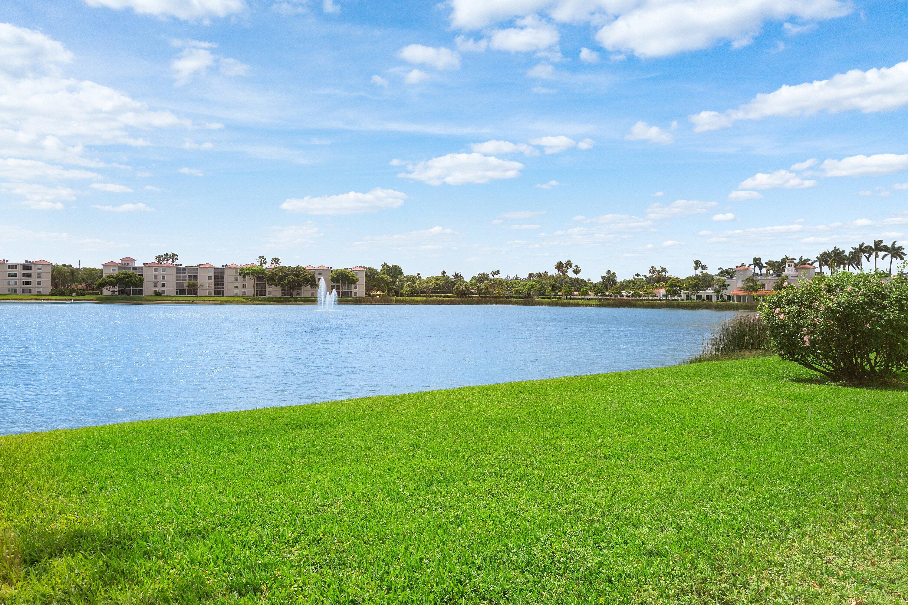 14096 Huntington Pointe Drive, Unit 106 Delray Beach, FL 33484 - Photo 41 of 47 a view of a lake with houses in the back
