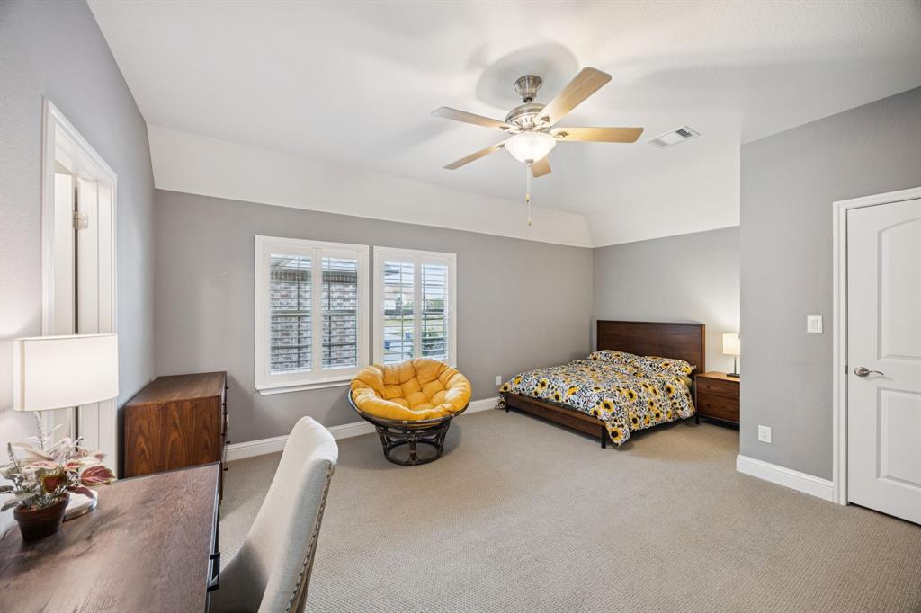 7121 Calypso Lane Frisco, TX 75036 - Photo 25 of 40 a bedroom with a bed and a window