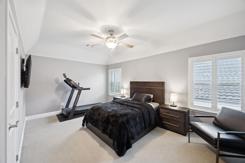 7121 Calypso Lane Frisco, TX 75036 - Photo 29 of 40 a bedroom with a bed a couch and a window