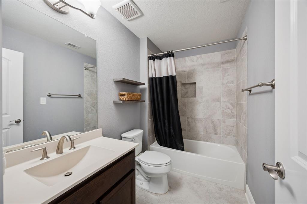 7121 Calypso Lane Frisco, TX 75036 - Photo 30 of 40 a bathroom with a sink toilet and shower