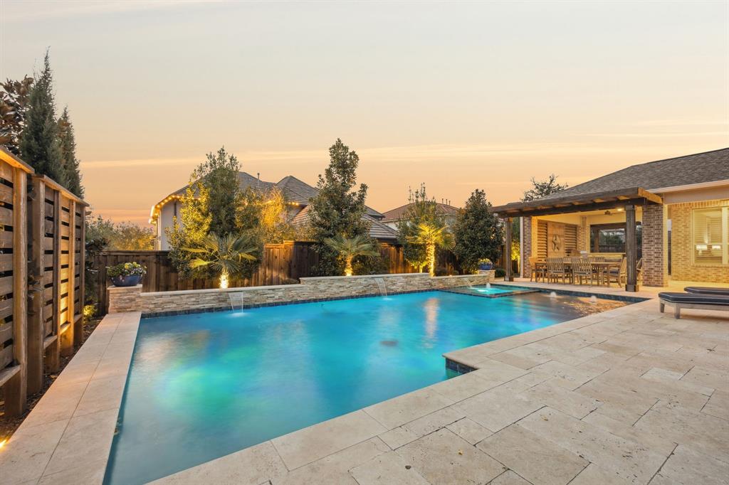 7121 Calypso Lane Frisco, TX 75036 - Photo 4 of 40 a view of swimming pool with outdoor seating and plants
