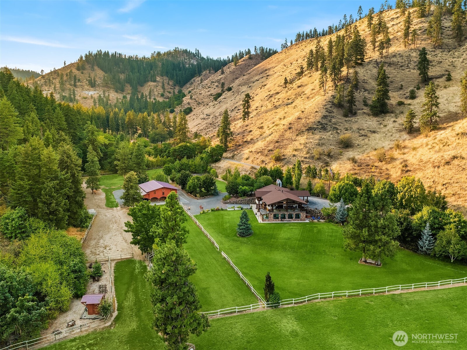 951 Willems Road Cashmere, WA 98815 - Photo 37 of 40 a view of a garden with a building in the background