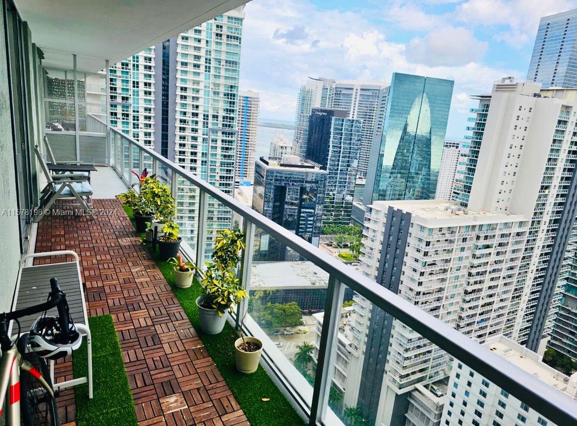 a city view from a balcony with outdoor space