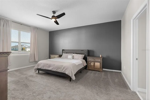 a bedroom with a bed and window