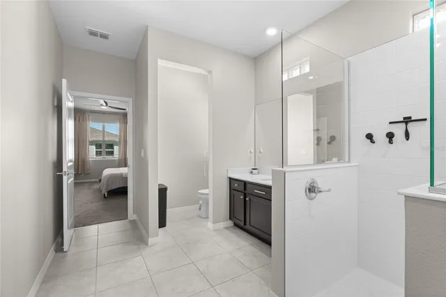 a view of a bathroom with tub shower