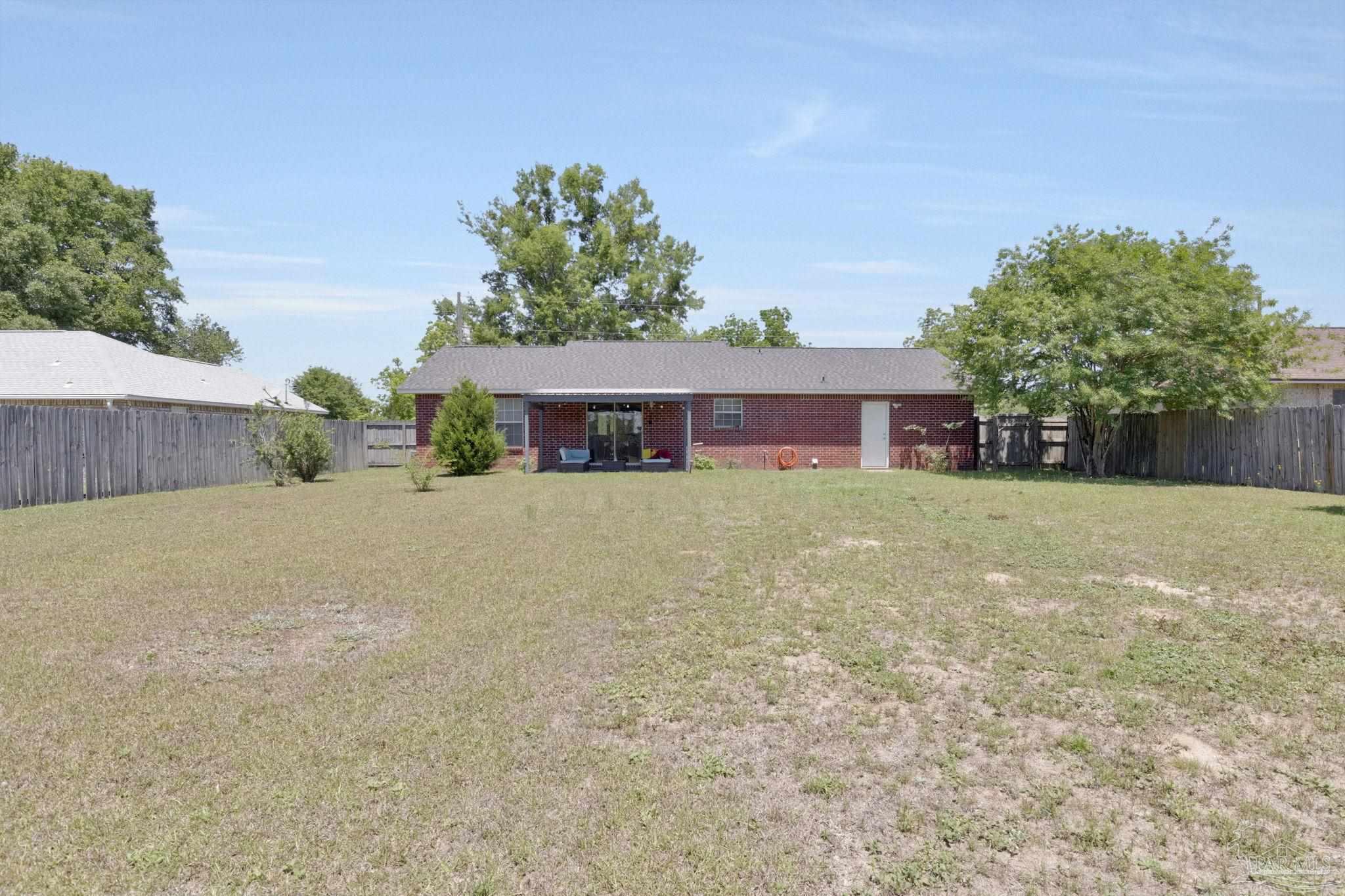 5539 Windrun Place Pace, FL 32571 - Photo 47 of 62 front view of a house with a yard