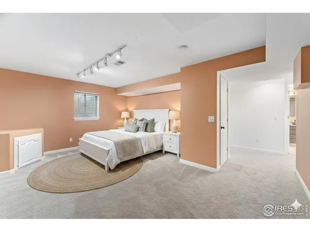 a bedroom with a bed and a couch