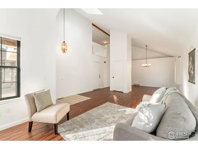 a bedroom with a bed and a chair