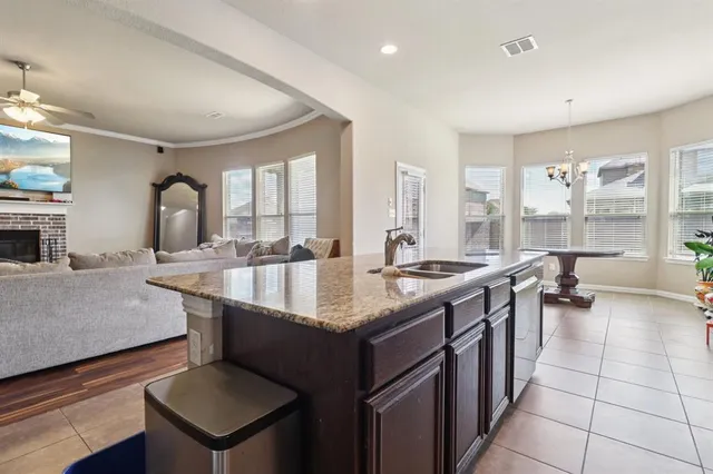 an aerial view of residential houses with outdoor space and ocean view