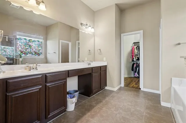 a bathroom with a tub and shower