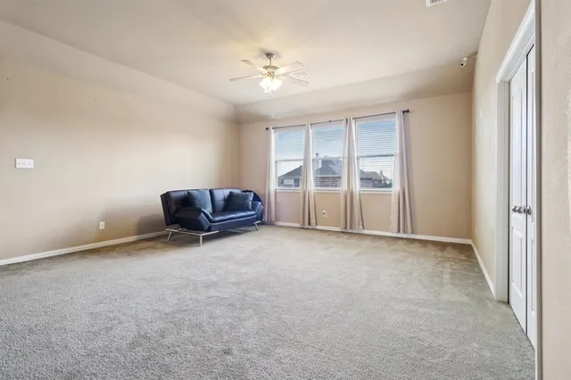 a large bathroom with a tub sink and mirror