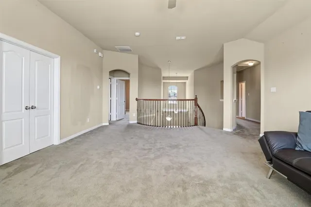 a view of livingroom with furniture and chandelier fan