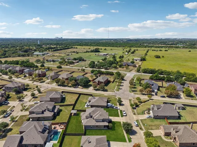 an aerial view of residential building and parking space