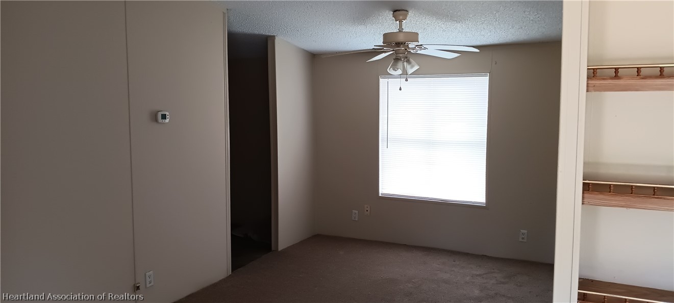 1026 Cardinal Road Wauchula, FL 33873 - Photo 6 of 12 a view of an empty room with a window