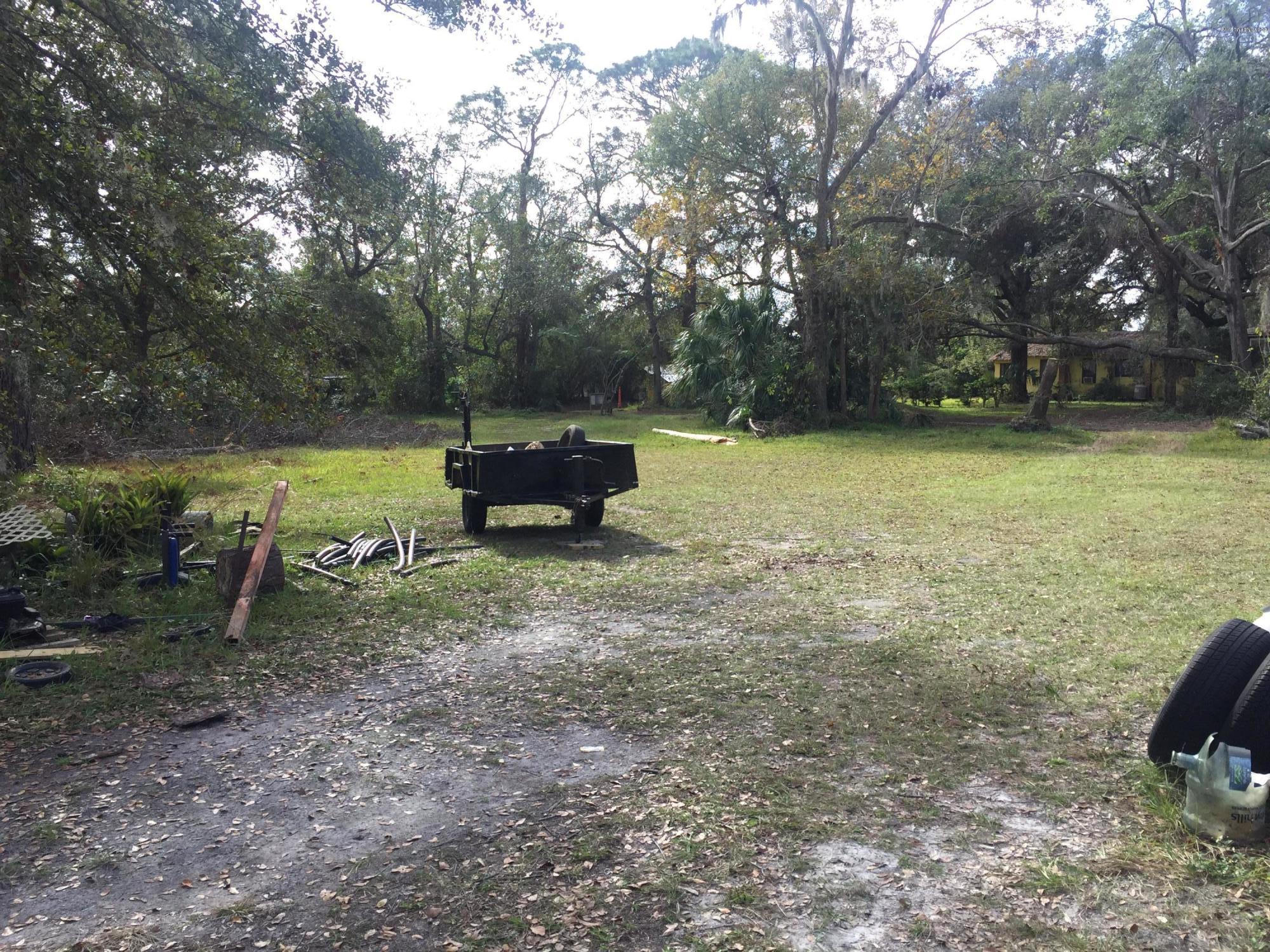4527 Fennell Road Jacksonville, FL 32244 - Photo 20 of 38 a view of a yard with an outdoor seating