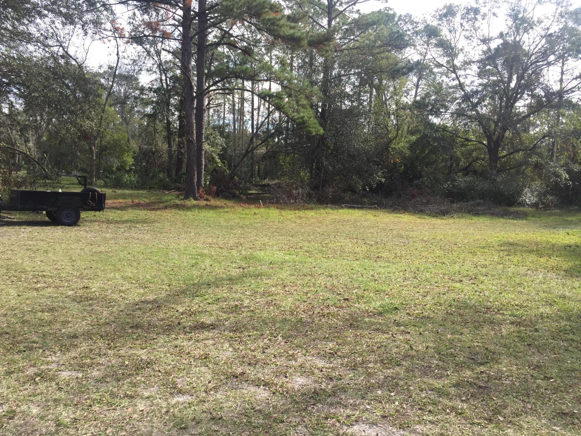 4527 Fennell Road Jacksonville, FL 32244 - Photo 21 of 38 a view of a yard with a trees