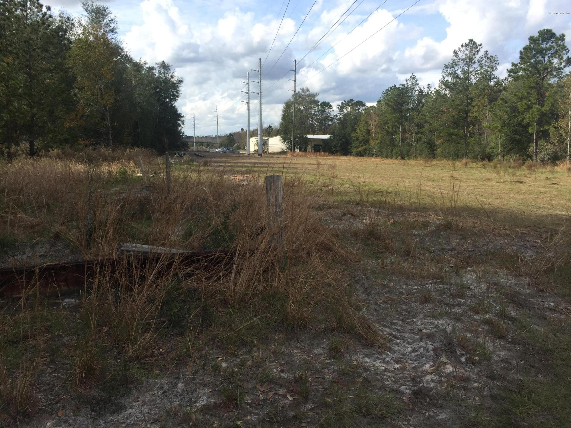 4527 Fennell Road Jacksonville, FL 32244 - Photo 33 of 38 a view of a yard with a tree