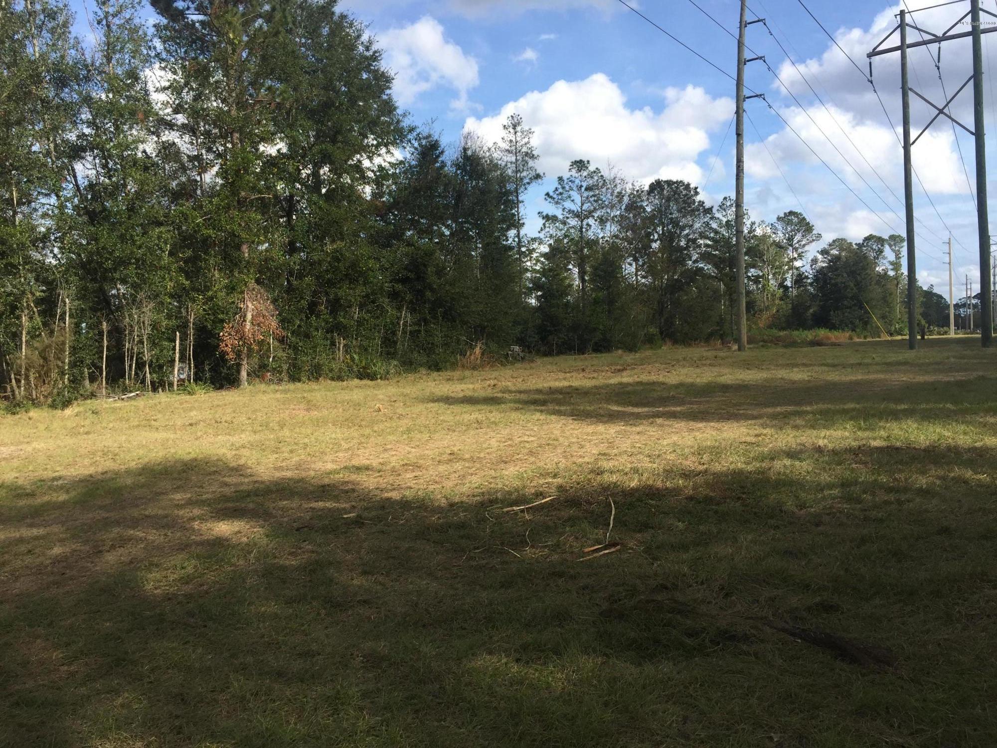 4527 Fennell Road Jacksonville, FL 32244 - Photo 34 of 38 a view of a yard with a tree