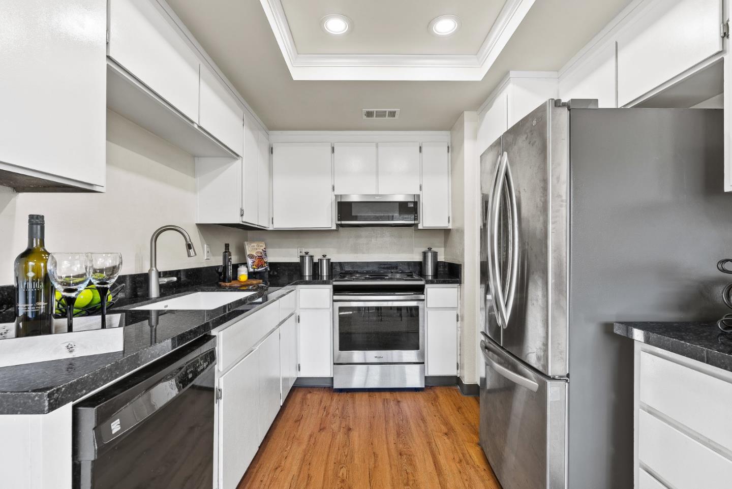 4207 Topsail Court Soquel, CA 95073 - Photo 7 of 19 a kitchen with stainless steel appliances a refrigerator sink and microwave