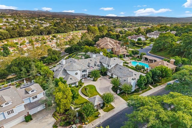 an aerial view of residential house with outdoor space and street view