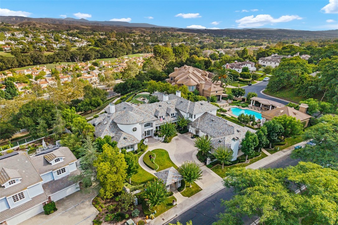 an aerial view of residential house with outdoor space and street view