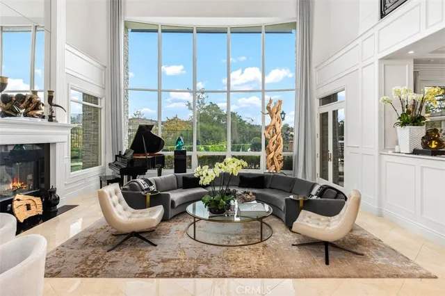 a living room with furniture a window and a fireplace