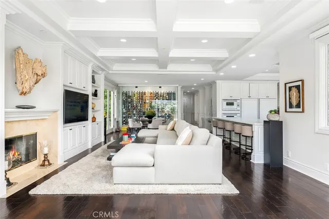 a living room with fireplace furniture and a flat screen tv