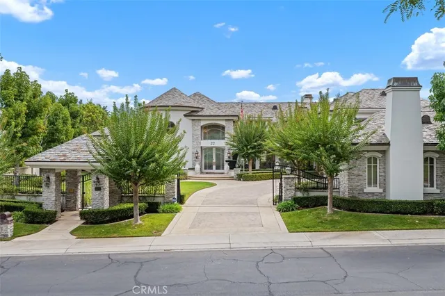 a view of a house with a yard and plants