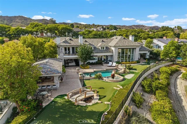 a view of swimming pool with seating space