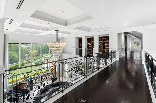 a view of a house with pool and chairs
