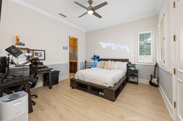 a living room with furniture and large windows