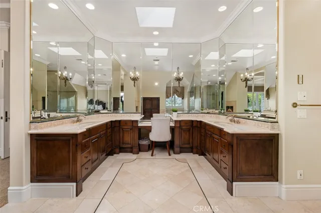 a living room with furniture and large windows
